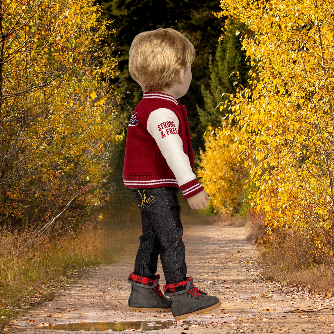 Two 18-dolls wearing matching red and white Canadian bear varsity jackets.