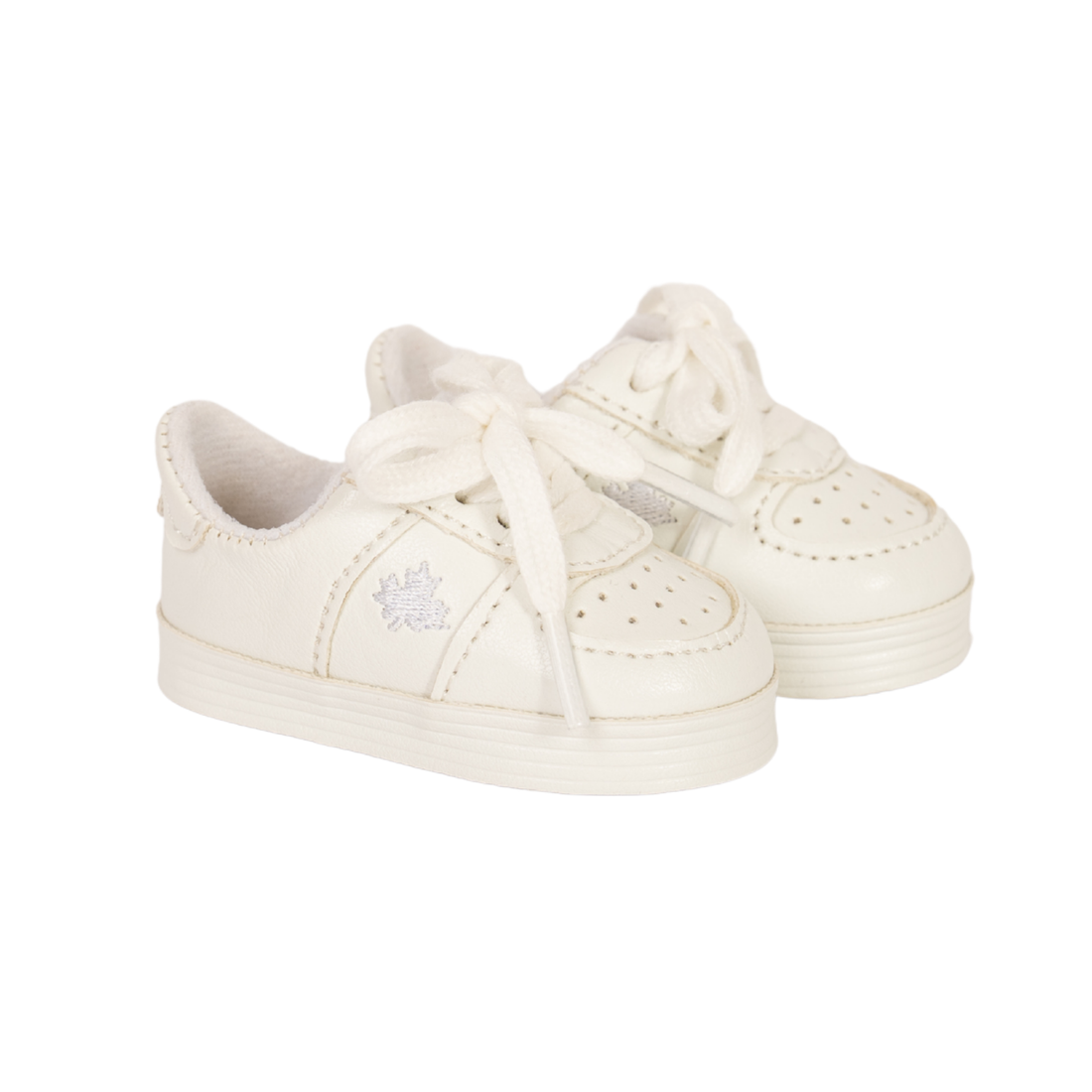 A pair of off-white doll sneakers with matching laces, featuring a textured toe cap, perforated details, and a small embroidered logo on the side, set against a plain white background.