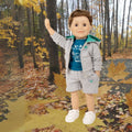 Maplelea boy doll wearing grey camping hoodie with matching teal graphic t-shirt, shorts and runners