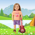 Leonie holding red guitar in cute summer happy camper short pajamas with brown sandals 