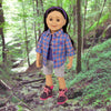 18" Maplelea doll hiking in forest with plaid camp shirt shorts and purple and pink hiking boots
