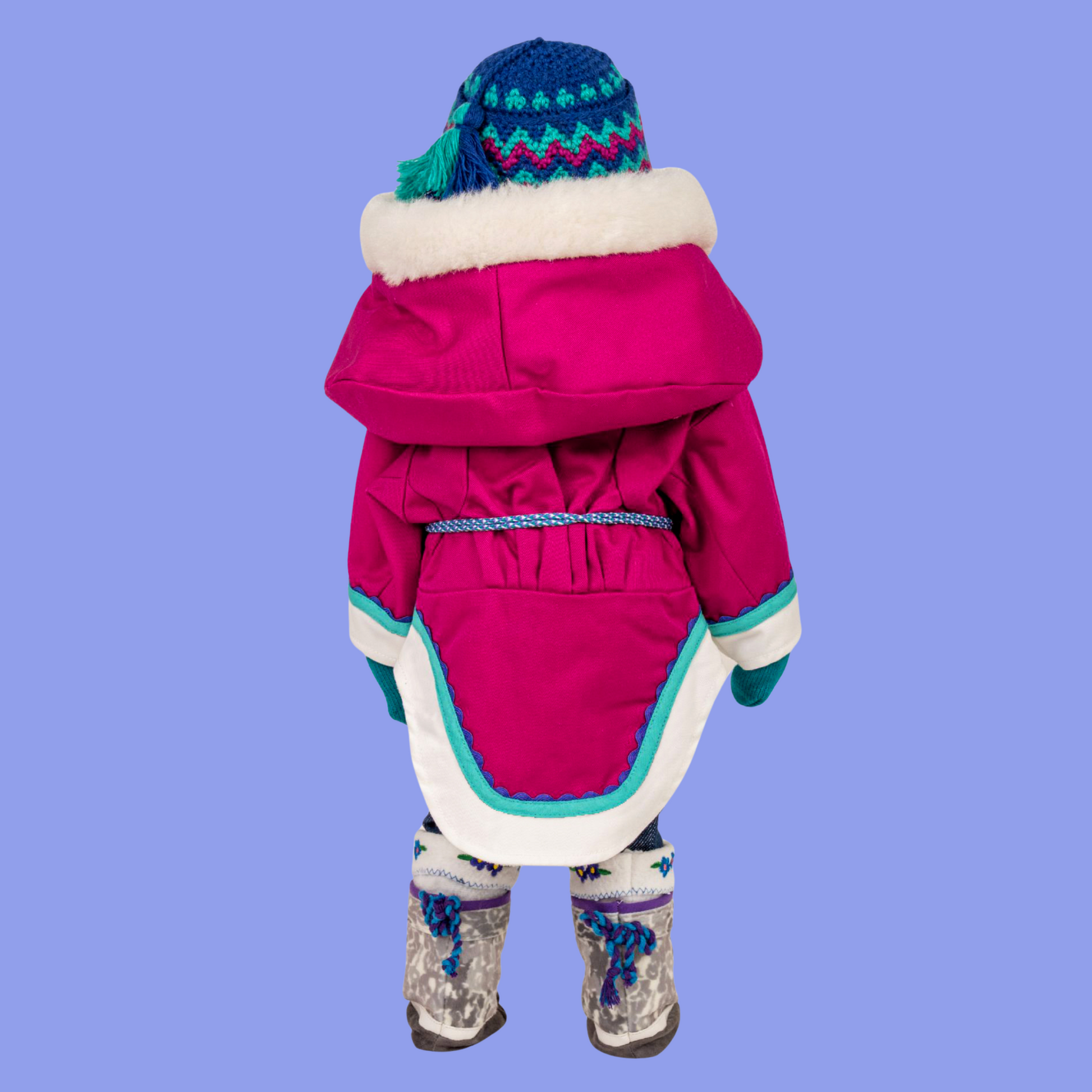 18-inch doll wearing a pink amauti coat, hat, and boots. 