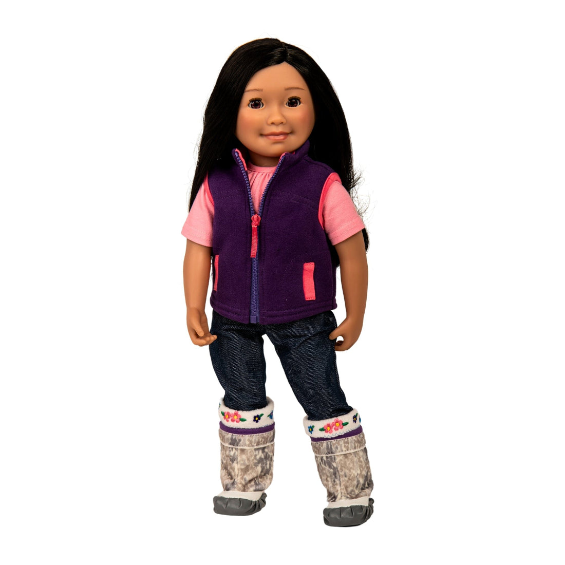 Saila 18-inch Inuit doll from Iqaluit Nunavut in Canada's Arctic, wearing her pink t-shirt, purple fleece vest, denim jeans, and traditional kamik boots with sock liners