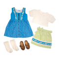 A doll outfit set laid out on a white background, including a blue patterned dress with white floral trim, a white short-sleeve blouse, a light green skirt with a blue floral band and bow, white socks, and brown shoes. Close-up of Edelweiss detailing, lace trim and printed apron on doll dirndl dress. 18-inch Maplelea