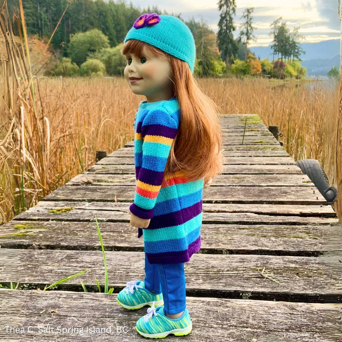 Colourful striped Nova Scotia inspired sweater set with white runners on Maplelea Jenna doll.