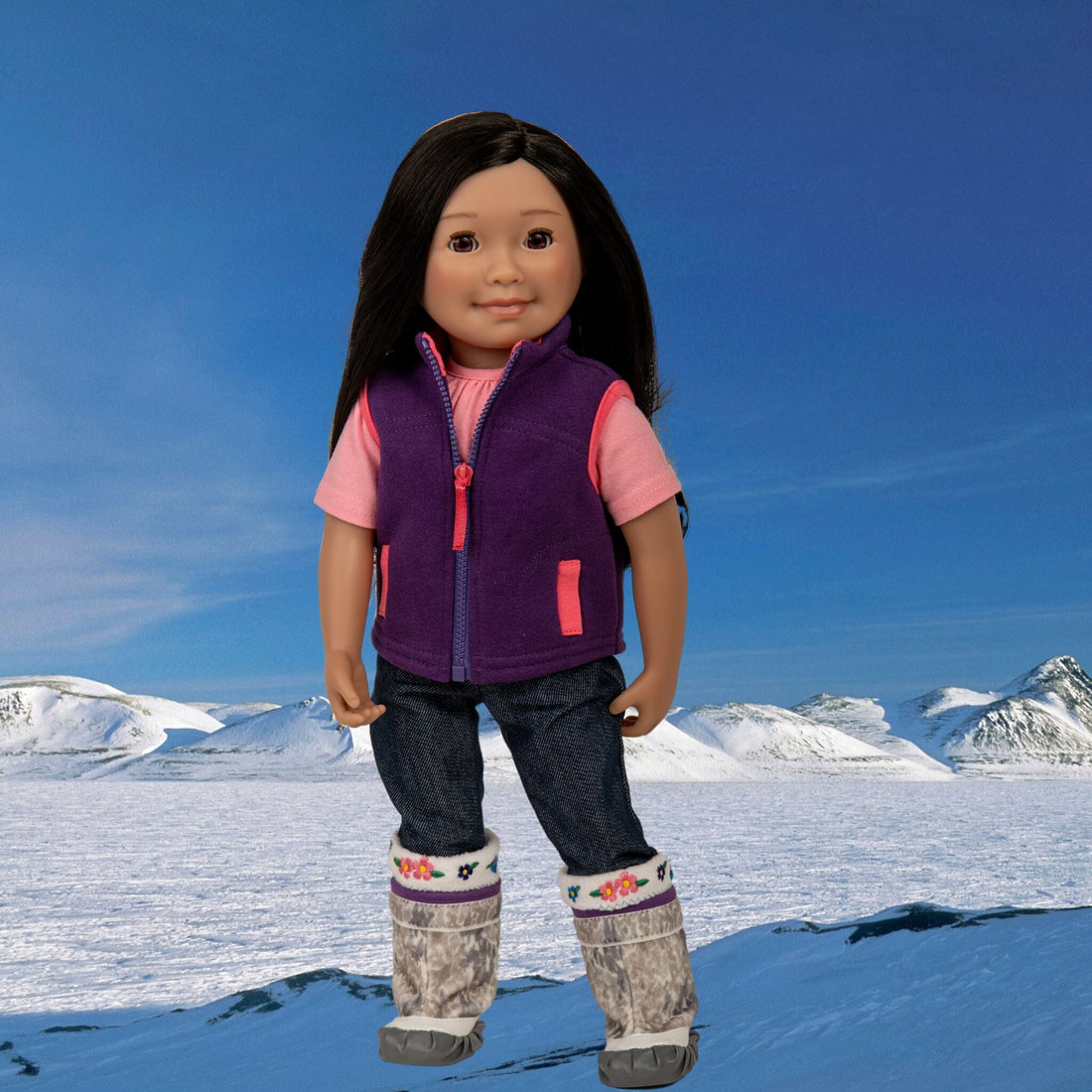 Saila 18-inch Inuit doll from Iqaluit Nunavut in Canada's Arctic, wearing her pink t-shirt, purple fleece vest, denim jeans, and traditional kamik boots with sock liners