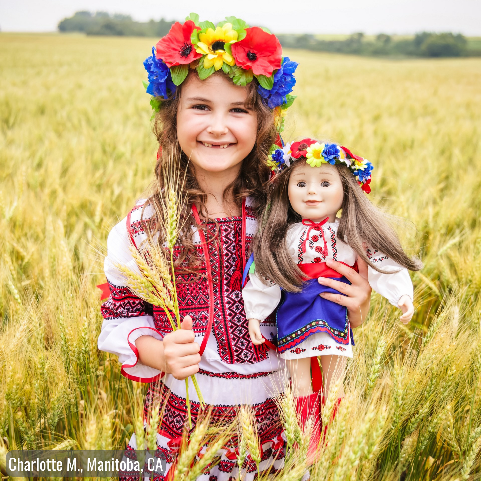 girl holding 18-inch doll wearing Ukrainian dance outfits 