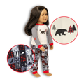 A doll wearing a two-piece pajama set with a white and gray long-sleeve top featuring a black bear graphic, matching patterned pants, and red trim. Two circular inset detail callouts highlight the top and pants patterns against a white background.
