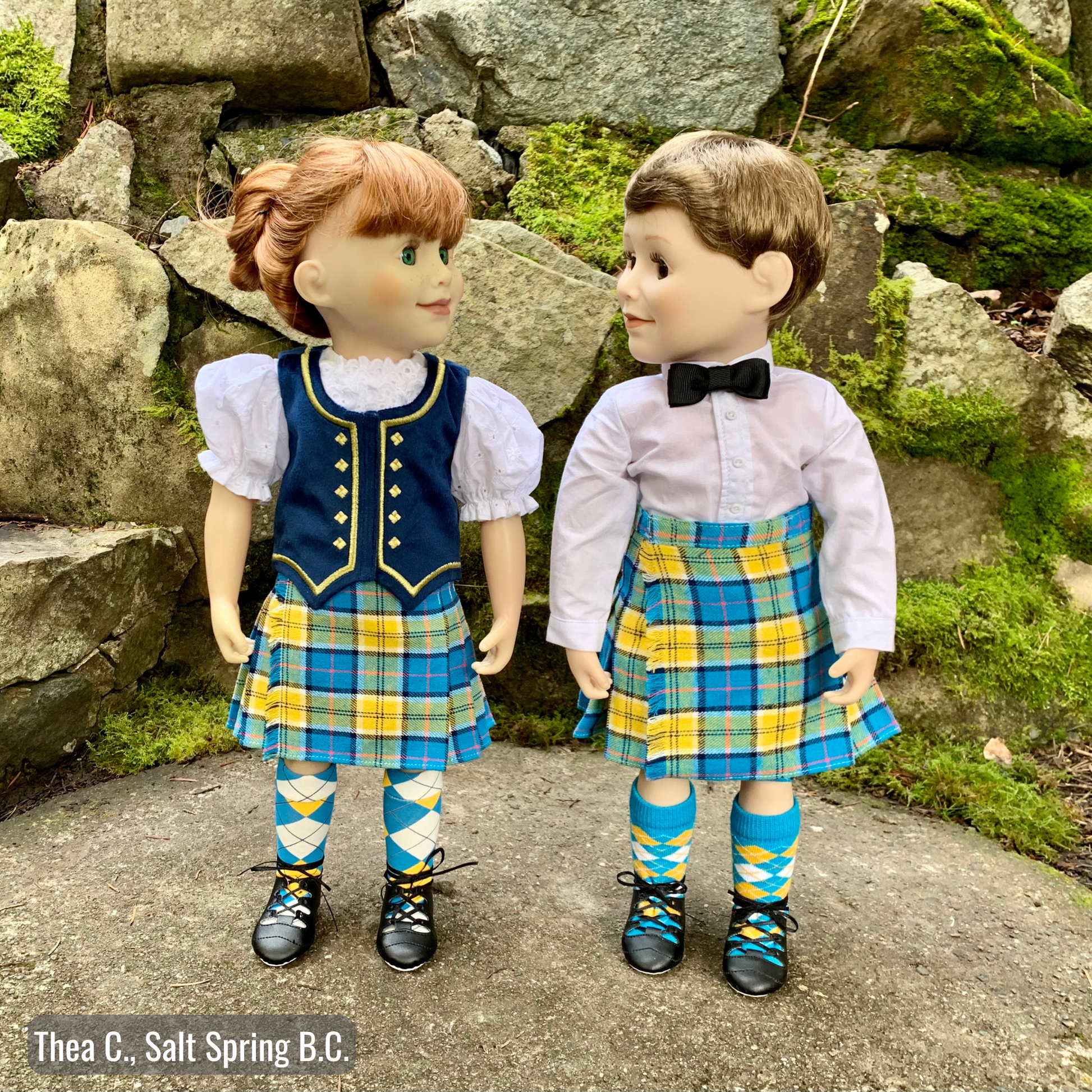 boy and girl doll wearing highland dance set with kilt and ghillies