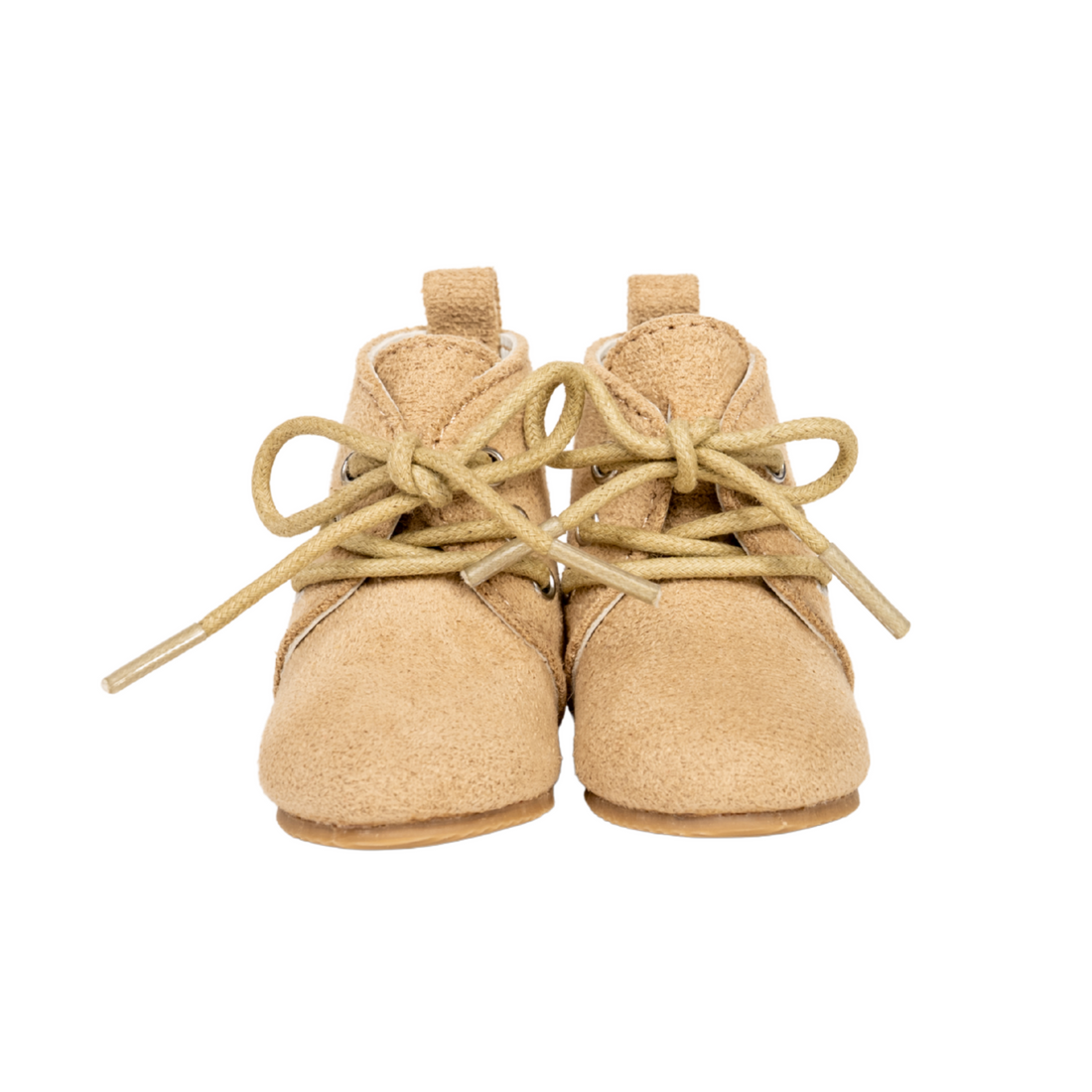 Pair of beige boots with suede-like fabric, and metal grommets with real tie up laces for 18-inch dolls.