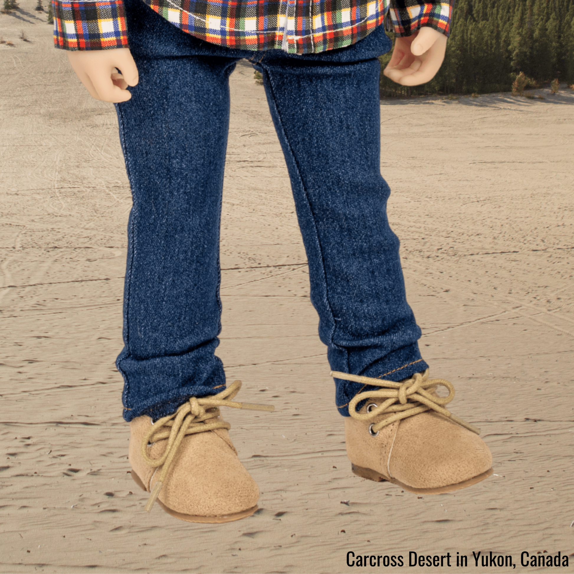 18-inch doll wearing blue jeans and beige lace-up boots in the Carcross Desert in Yukon, Canada.
