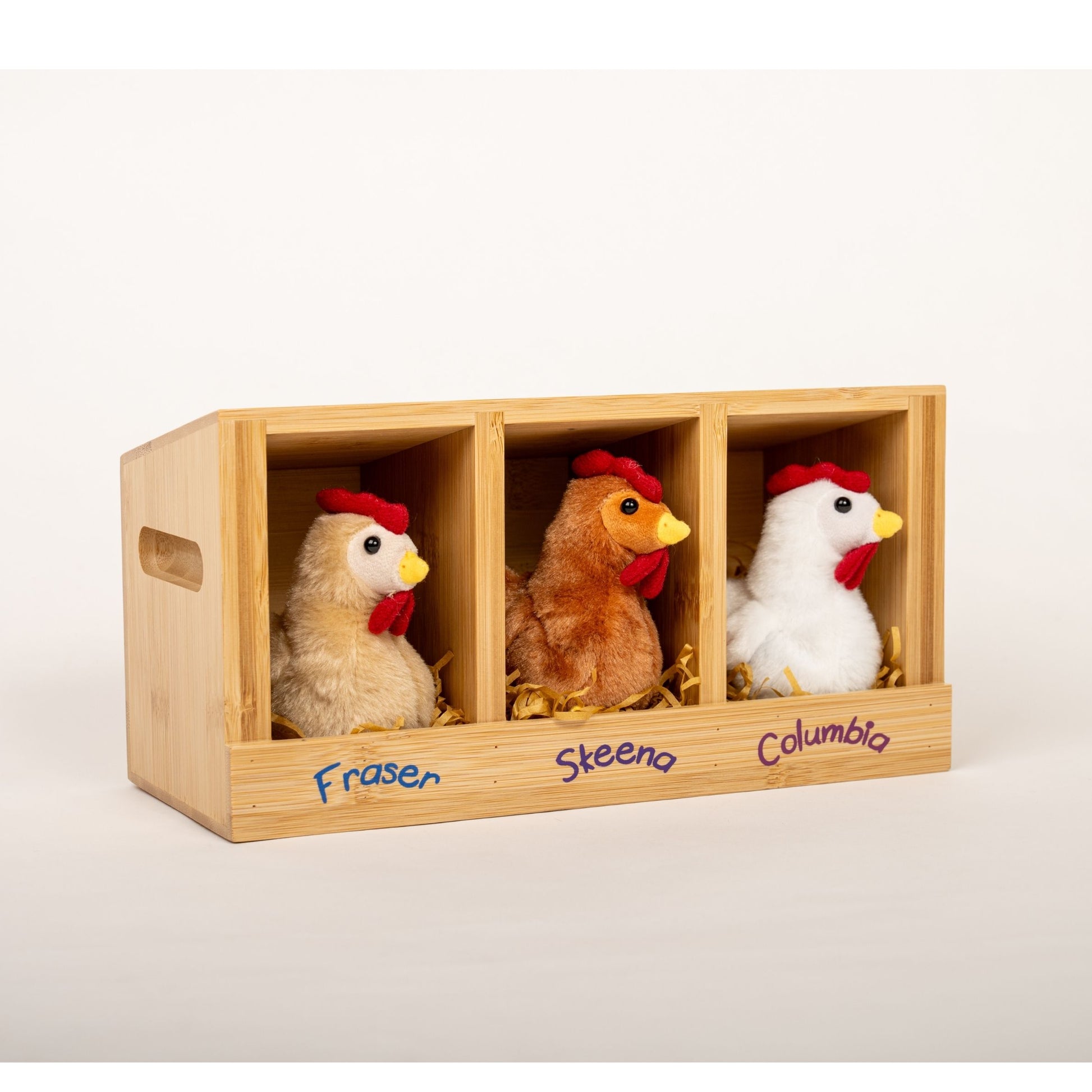 Three plush chickens in a wooden chicken coop with 'Fraser', 'Steena', and 'Columbia' labels for creative play with 18-inch dolls