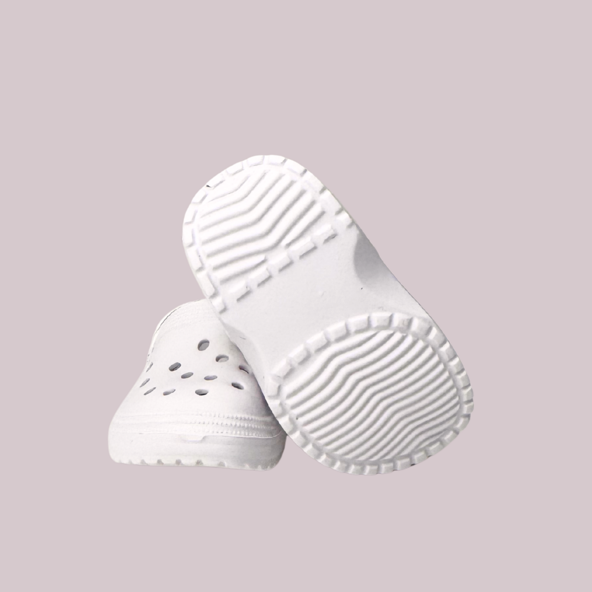 Maplelea white foam clogs for 18-inch dolls with ventilation holes and heel strap for security.