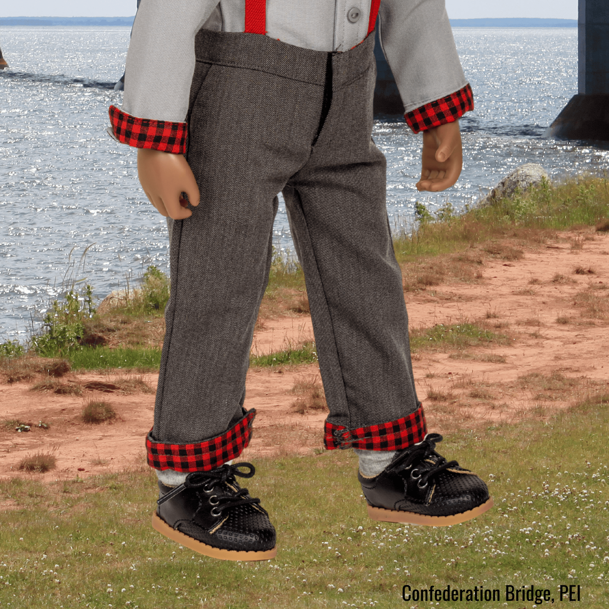 18-inch Maplelea doll wearing black lace up shoes in plaid and grey outfit in Prince Edward Island.