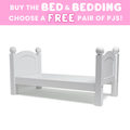 White bed with a pink promotional banner offering free PJs with bedding and bed purchase.