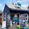 a photo pf jenna in front of the canadian sea turtle centre in halifax wearing her sea turtle expedition set.