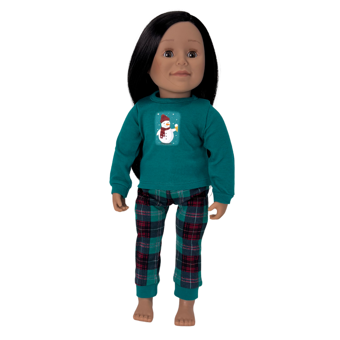 Doll wearing a teal shirt with a snowman design and plaid pants.