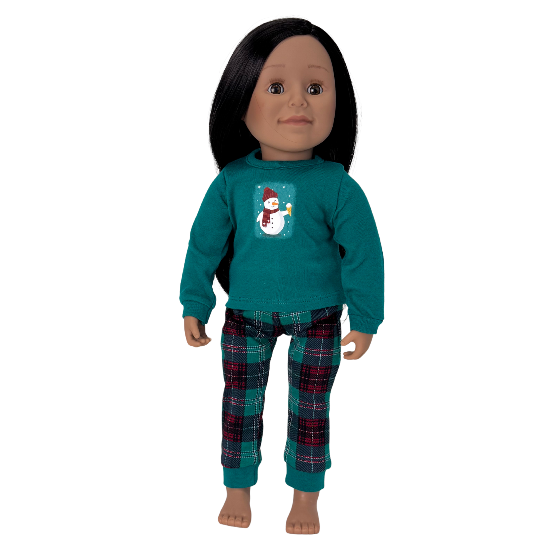 Doll wearing a teal shirt with a snowman design and plaid pants.