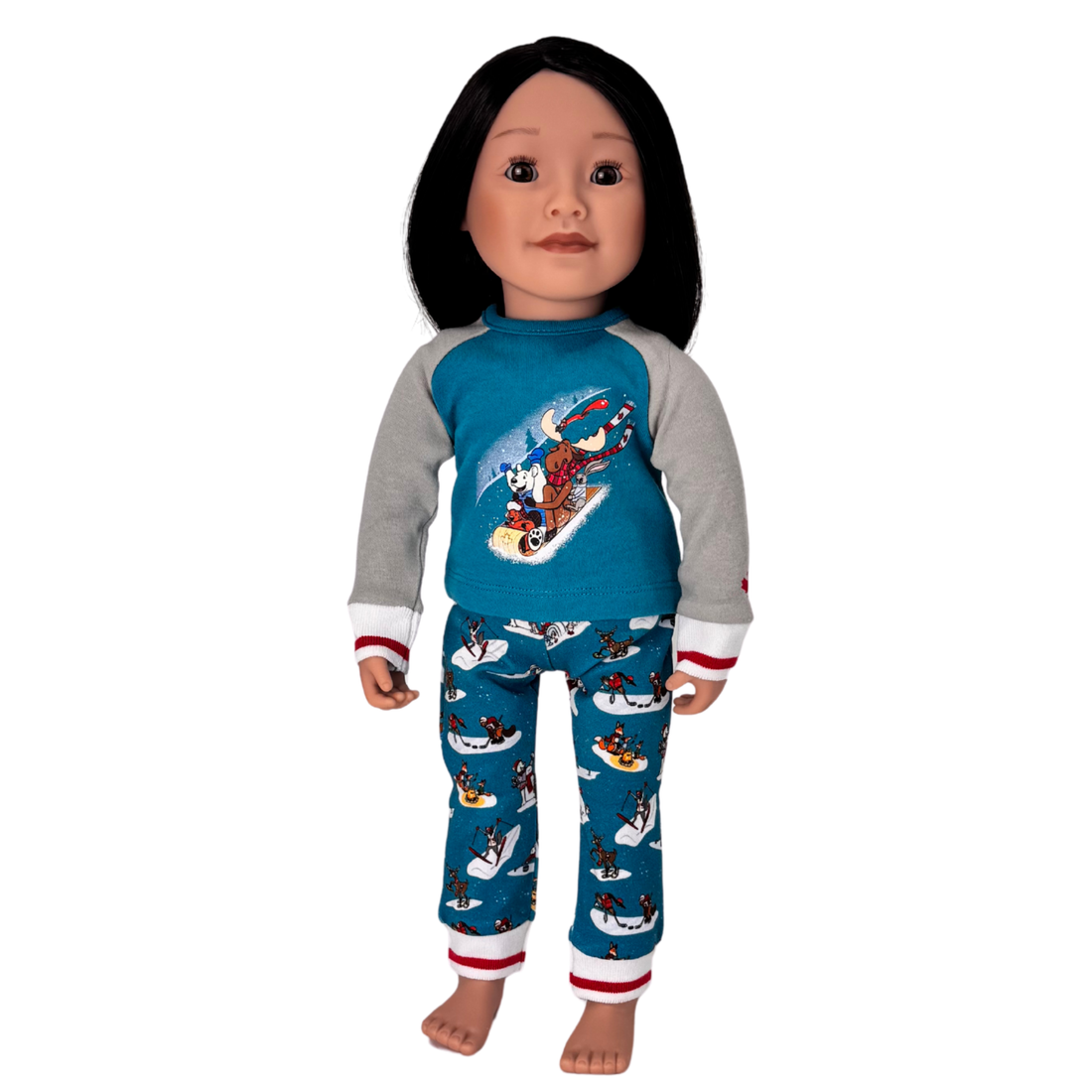 Doll wearing a blue and gray pajama set with a winter design.