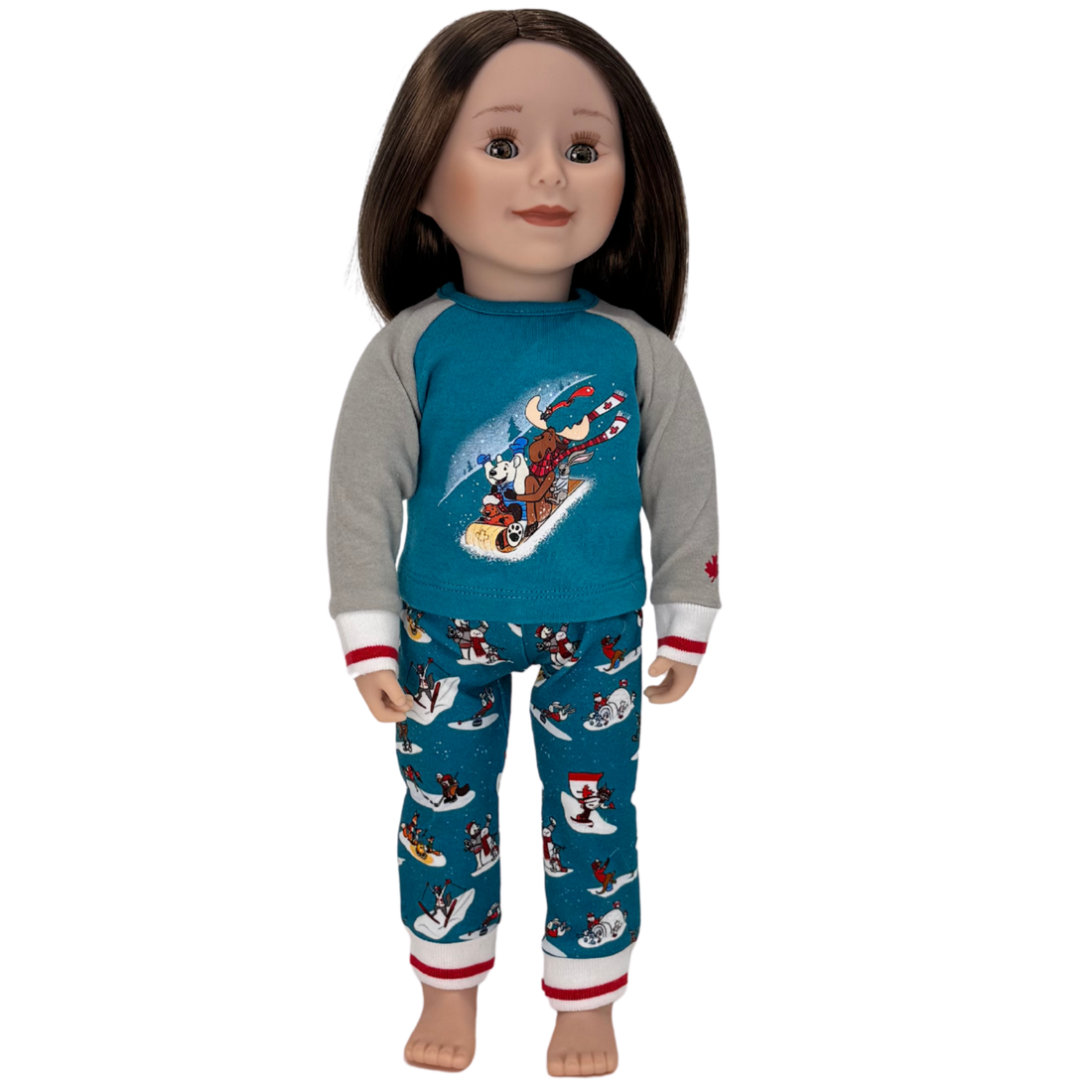 Doll wearing a blue pajama set with a moose and polar bear on a sled design.