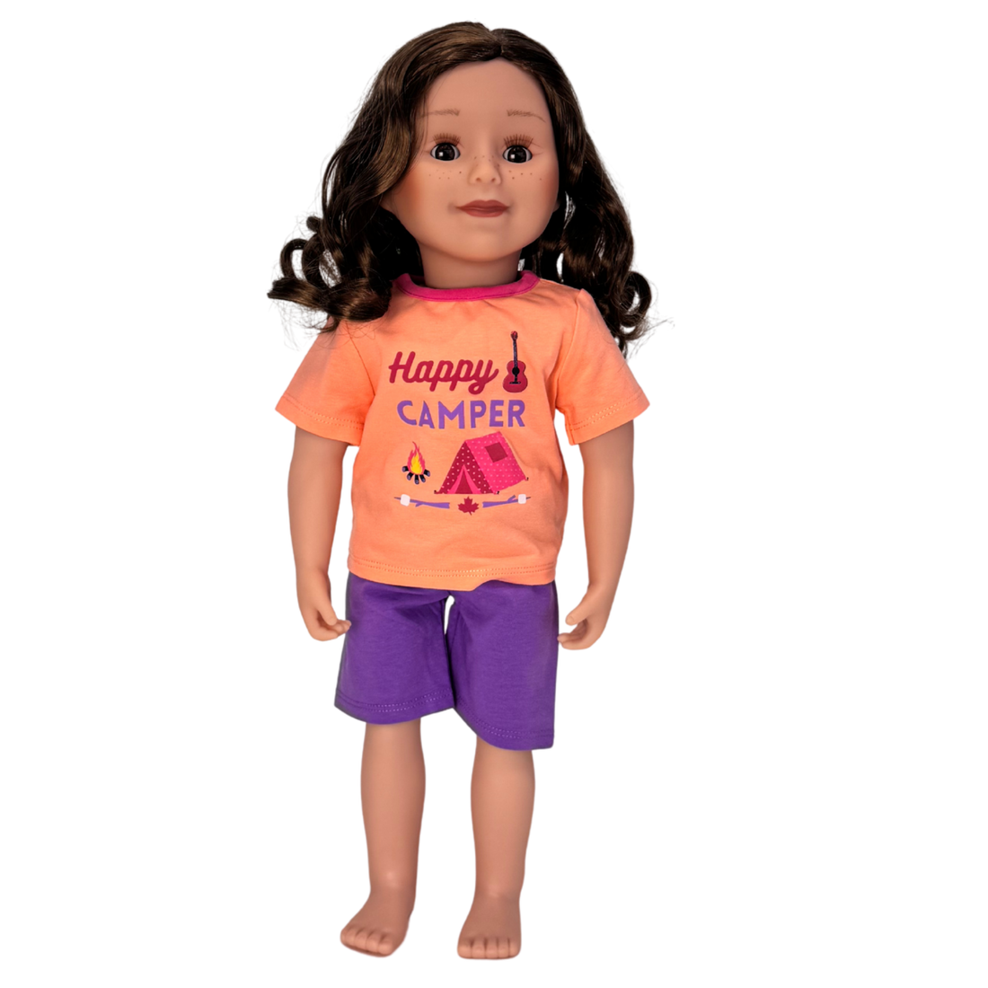 Doll wearing an 'Happy Camper' shirt and purple shorts.