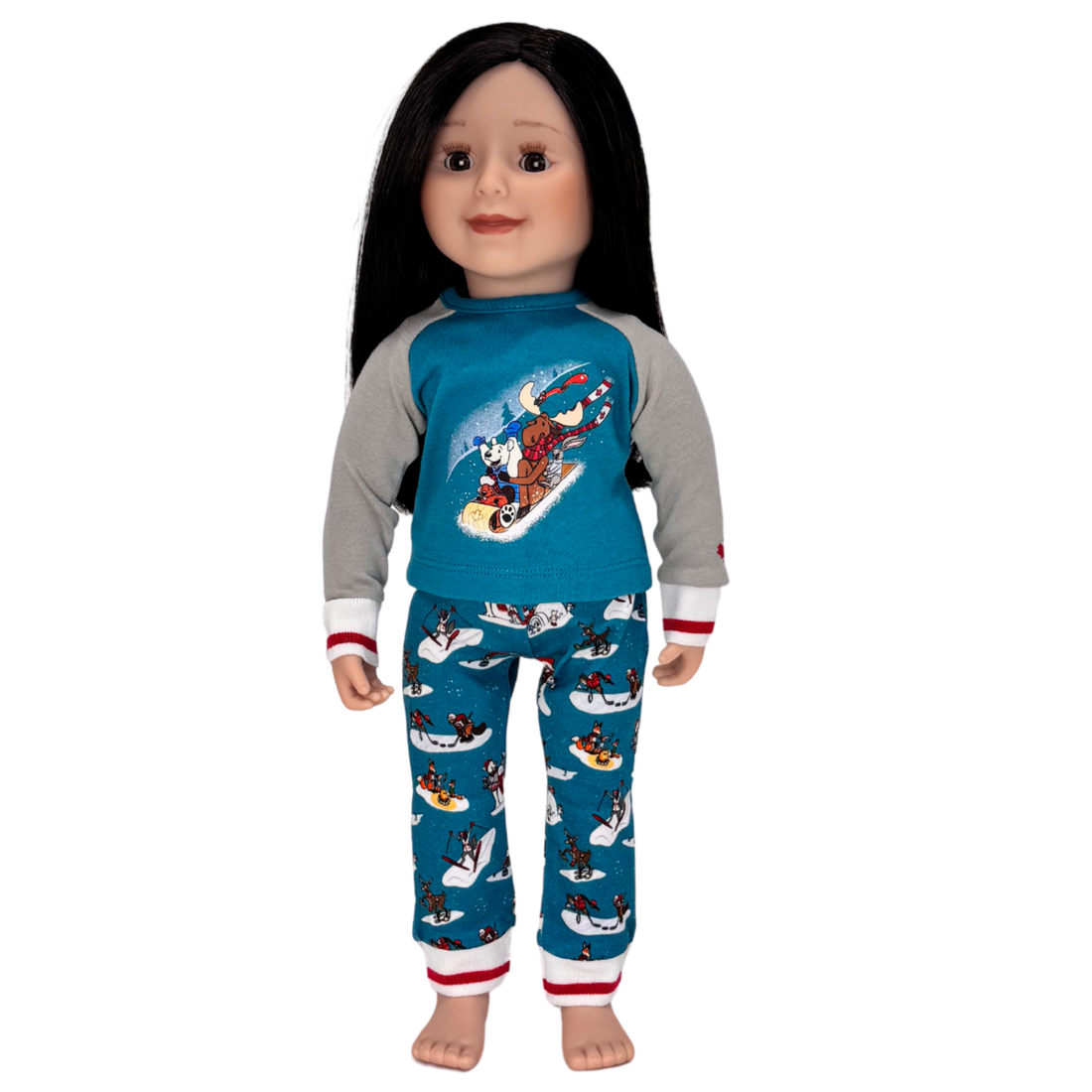 Doll wearing a blue pajama set with a polar bear and moose on a sled design.