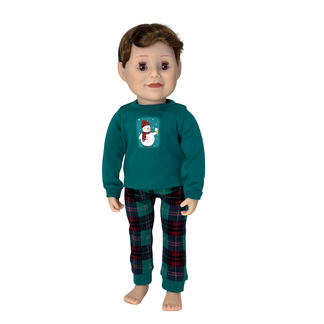 Doll wearing a teal shirt with a snowman design and plaid pajamas.
