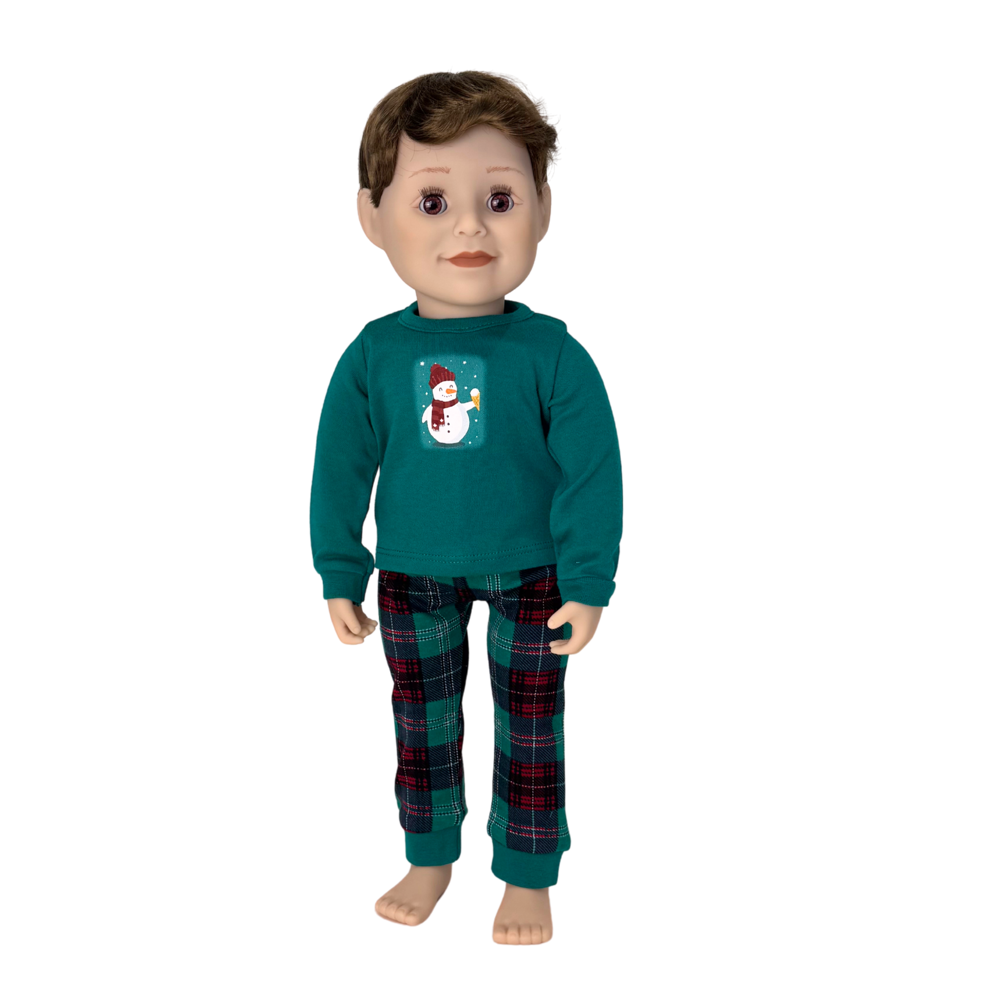 Doll wearing a teal shirt with a snowman design and plaid pajamas.