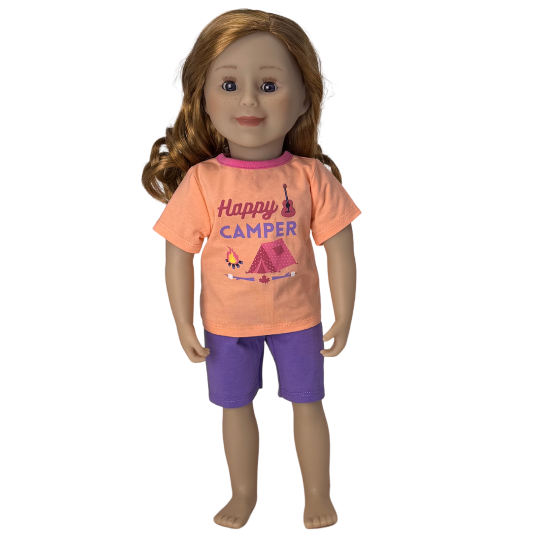 Doll wearing an 'Happy Camper' shirt and purple shorts.