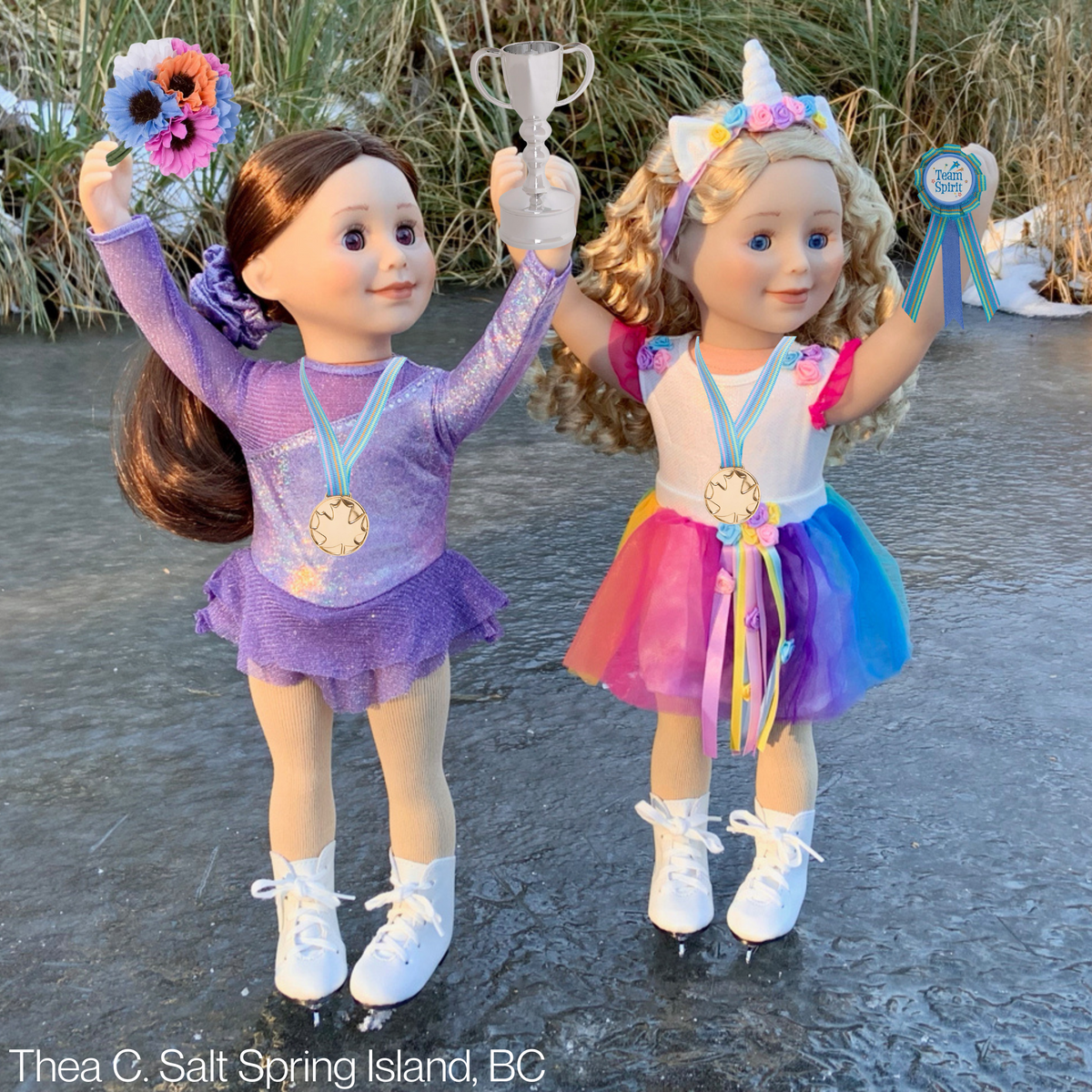 two 18-inch dolls holding trophies wearing their ice skating and magical unicorn outfits 
