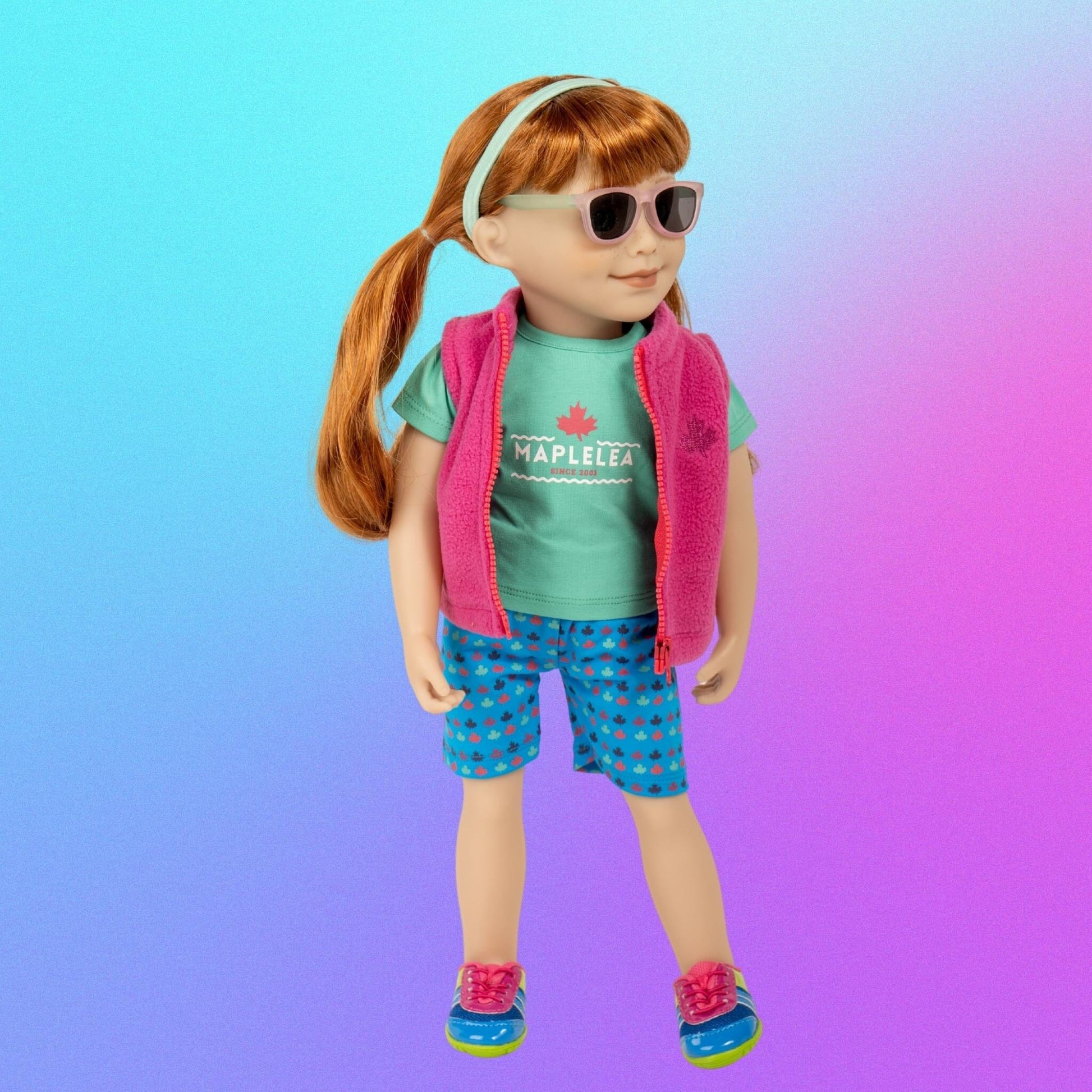 Maplelea 18"-inch Jenna doll cute in colourful summer camp outfit with vest t-shirt hairband and shorts.