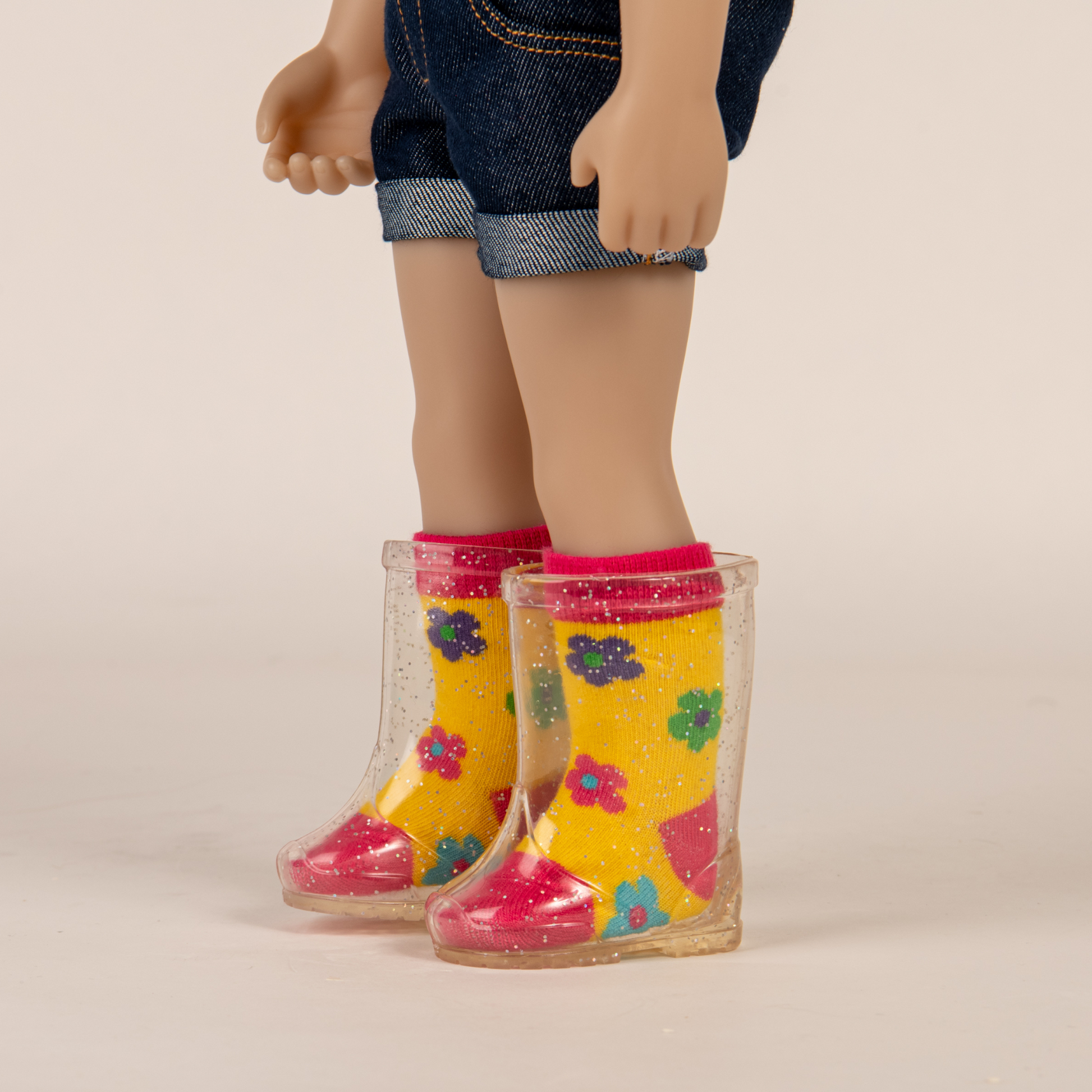 Clear sparkly rain boots fit all 18 inch dolls. 