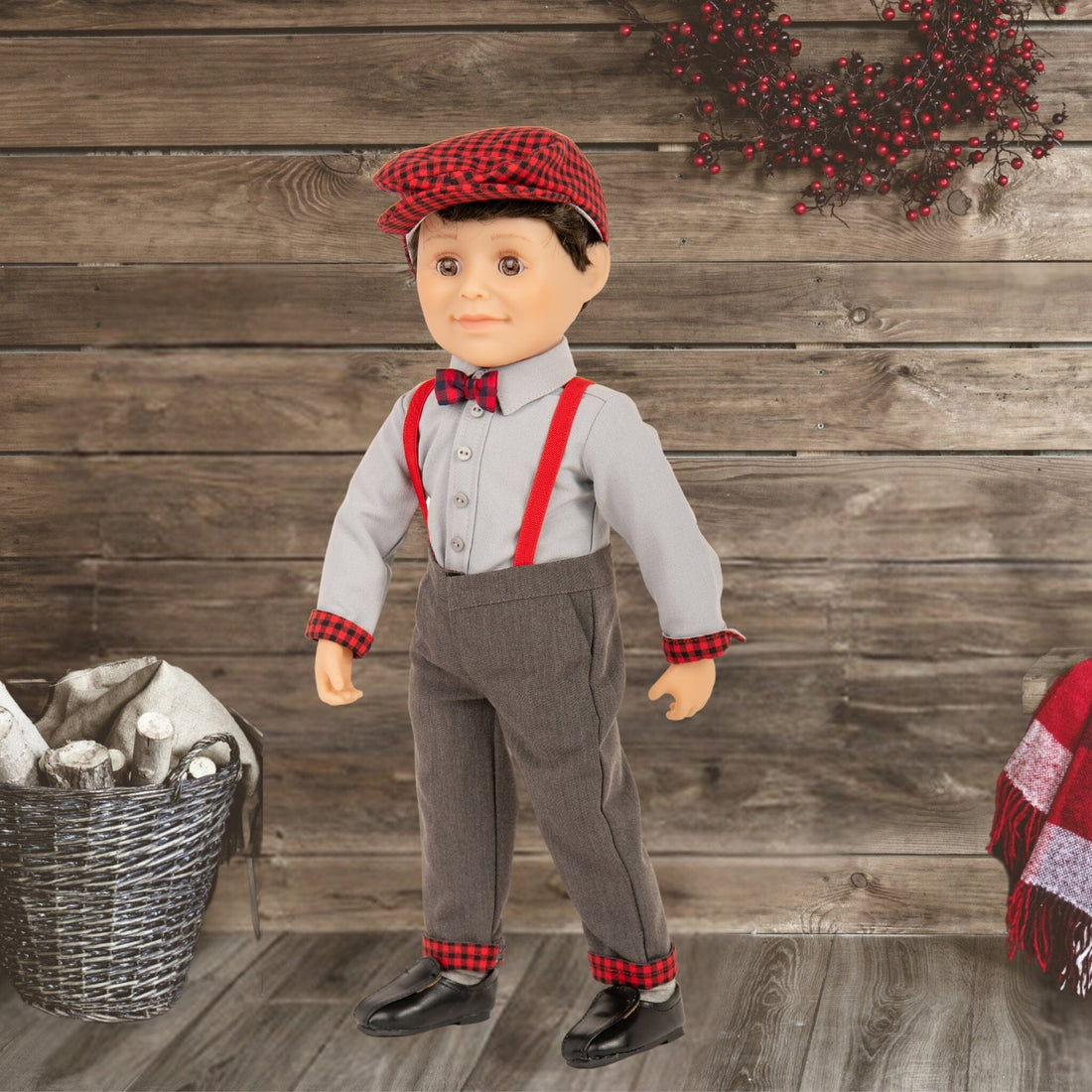 boy doll wearing grey button up shirt suspenders with plaid detailing and a plaid hat.