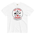 White adult T-shirt displayed on a light gray background, featuring a circular “True North Canada” graphic in red and black. The design includes crossed hockey sticks, a maple leaf, evergreen trees, a moose, and an Inukshuk, with the words “True North,” “Canada,” and “Strong & Free” arranged around the emblem.