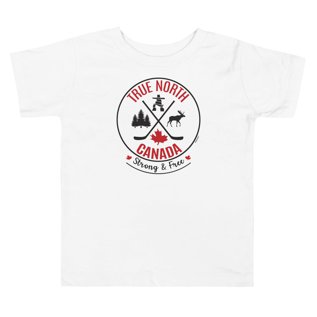 Toddler wearing a white “True North Canada” graphic T-shirt and blue jeans, standing against a light gray background. The shirt features a circular red-and-black design with crossed hockey sticks, a maple leaf, evergreen trees, a moose, and an Inukshuk, along with the words “True North,” “Canada,” and “Strong & Free.” The child is looking slightly to the side with a cheerful expression.