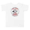 White toddler T-shirt displayed on a light gray background, featuring a circular “True North Canada” graphic in red and black. The design includes crossed hockey sticks, a maple leaf, evergreen trees, a moose, and an Inukshuk, with the words “True North,” “Canada,” and “Strong & Free” arranged around the emblem.