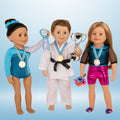 girl and boy dolls wearing athletic clothing holding flowers trophy and medals.