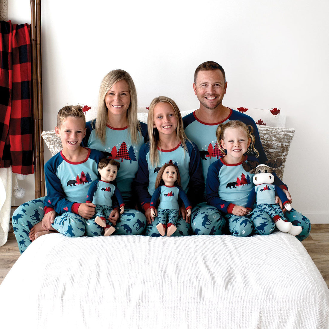 Mom dad adults wearing 100% cotton PJs pyjamas that match the whole family, doll, and dog.