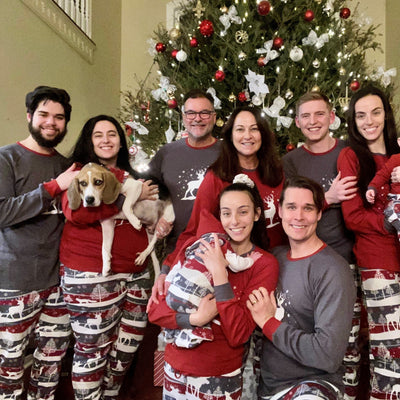 Large family dressed alike for the holidays in matching family pajamas.