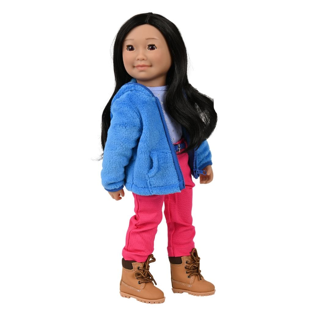 Inuit doll Saila wears comfortable clothing with work boots in Canada's north in the Spring