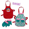 Reversible apron set with gingerbread holiday scene and floral pattern on the other side, and doll-sized oven mitts