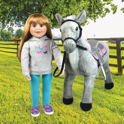 18 inch Canadian Girl doll wearing horse themed hoody with slip-on shoes aqua leggings beside her pony.