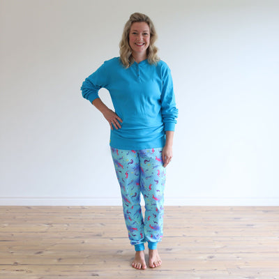 Teal top and colourful Sea Otter-patterned sleepwear PJs for adults to match Charlsea's pyjamas