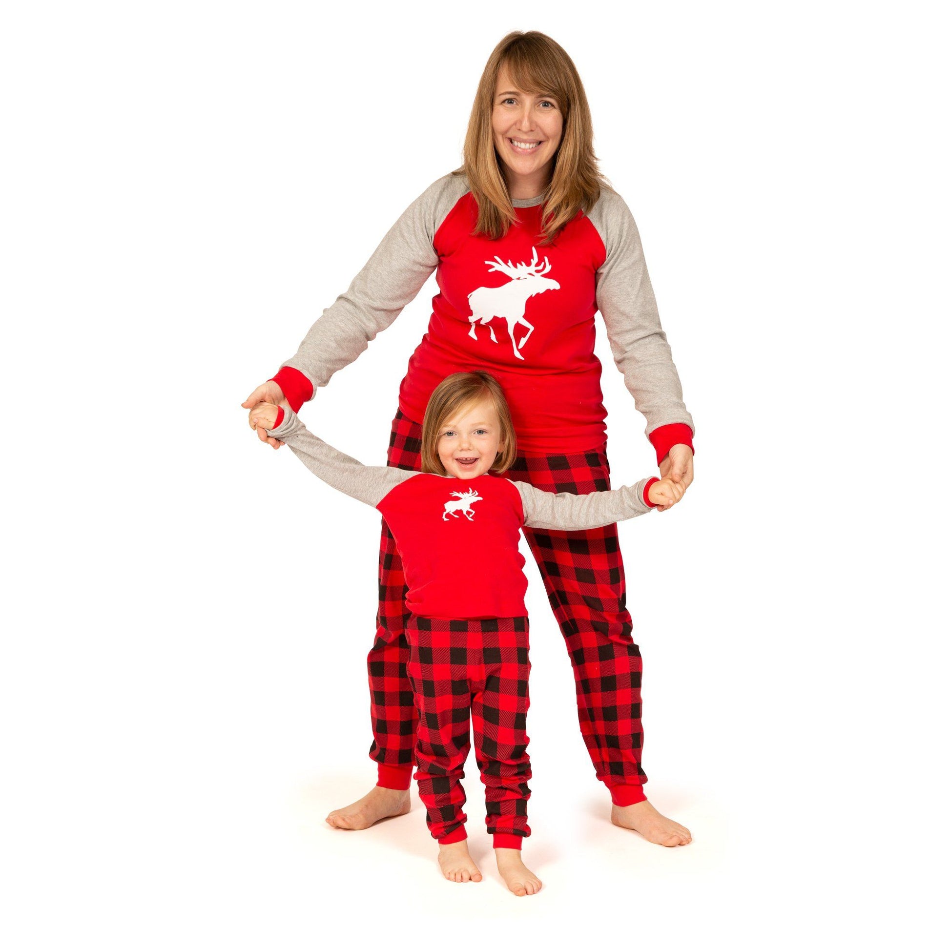 Matching red and black plaid pajamas for the whole family-adults, kids, doll and dog