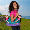 Girl with Maplelea Doll Tote carrying two 18 inch dolls.