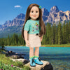 Maplelea 18 inch doll Taryn wearing green butterfly graphic t-shirt, khaki skirt, striped socks and blue hiking boots. Comes with story journal and storage box.
