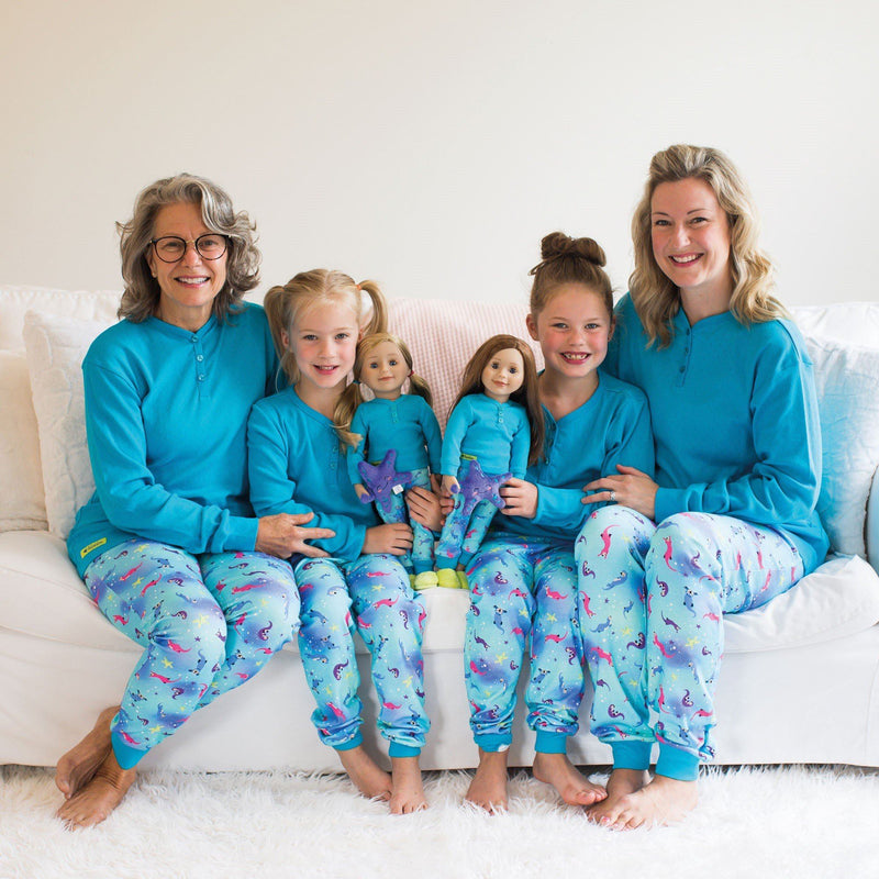 Sea Otter Sleepwear 2-piece blue pyjamas long-sleeved blue top with button henley, colourful sea otter print PJ pants in varying sizes for girls. 