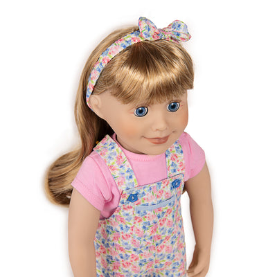 Blonde, blue-eyed doll wearing cute headband, tee shirt and overalls.  Top Canadian quality.