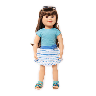 doll in summer dress with sunglasses on head
