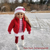 18 inch doll wearing knit sweater dress and hat skating on a frozen pond